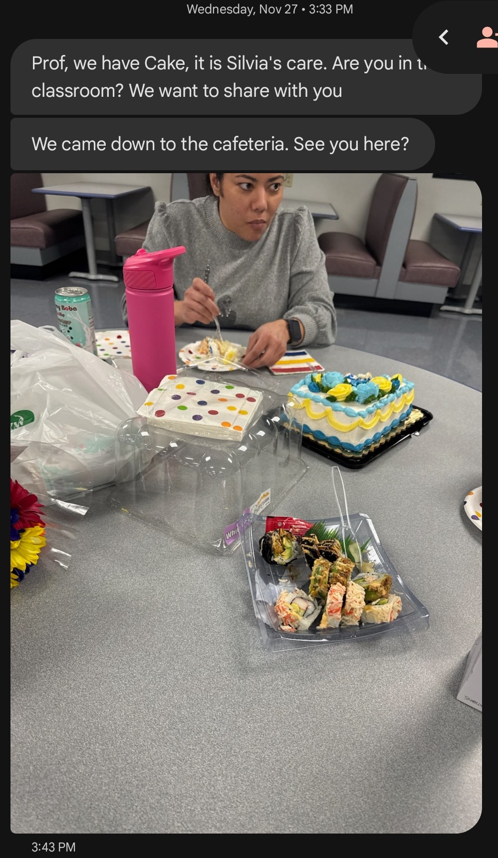 Students sharing cake to celebrate