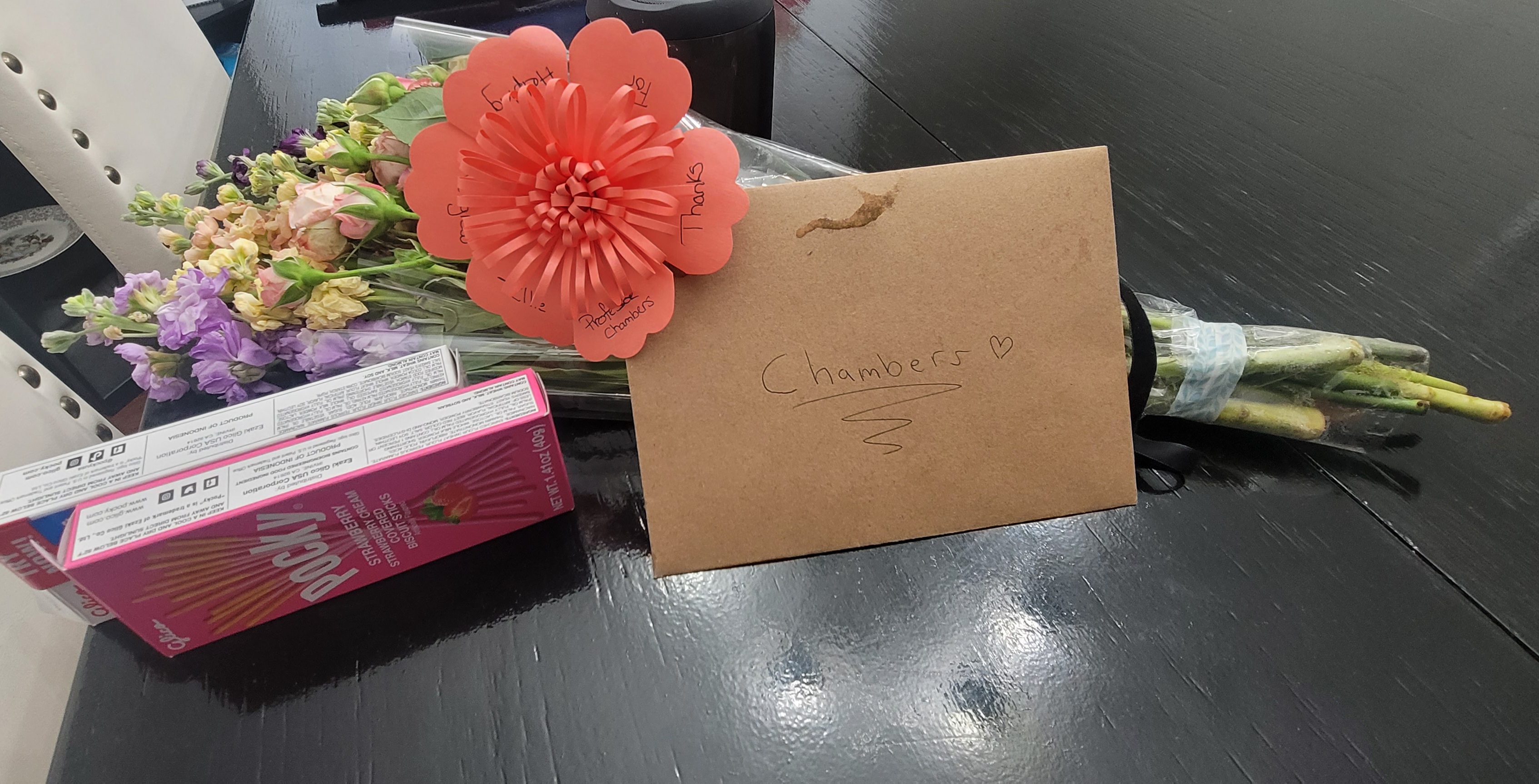 Flowers, snacks and a handwritten thank-you card
